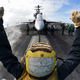 Illustration for article titled Here Is What All Those Colored Shirts Mean On An Aircraft Carriers Deck